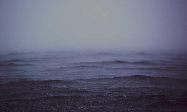 Salt flats stretching to the horizon at dusk